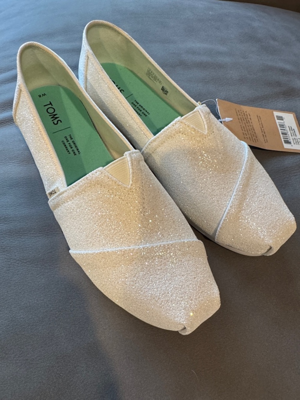 TOMS classic ivory glitter flats. NWT. Size 8.